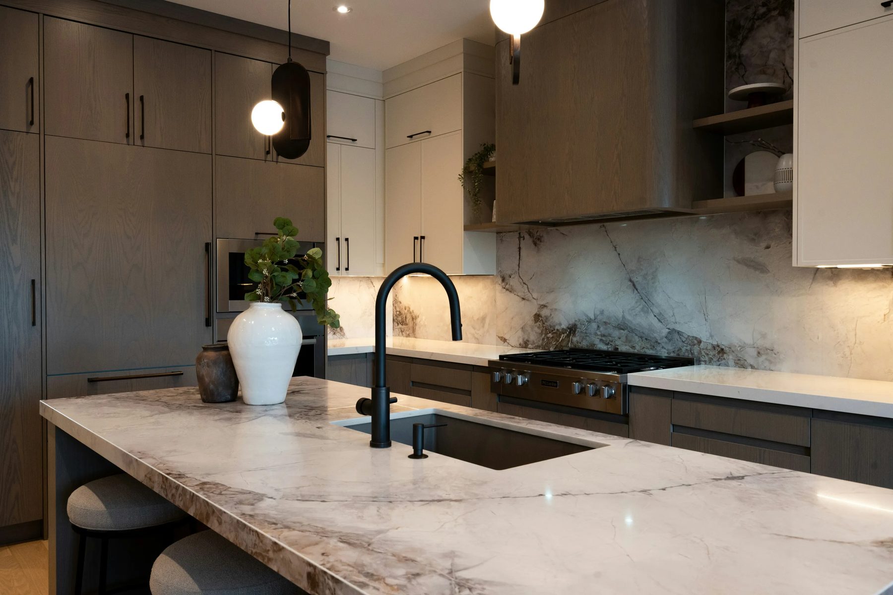 Marble island with white cabinetry